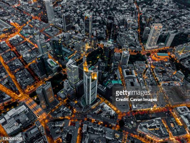 aerial overhead view of frankfurt am main, germany skyline at night with glowing streets - frankfurt main tower stock pictures, royalty-free photos & images