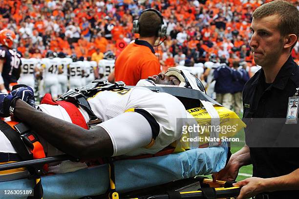 Desmond Marrow of the Toledo Rockets is taken off the field on a stretcher after an injury in the game against the Syracuse Orange on September 24,...