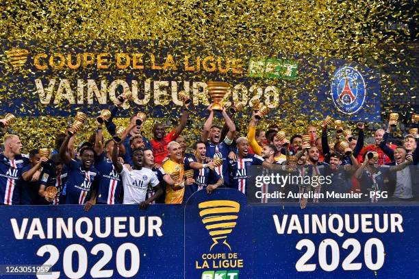 Paris Saint-Germain players raise the Trophy after winning the French League Cup final match against Olympique Lyonnais after the penalty kick...