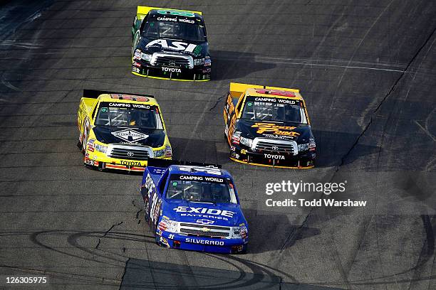 James Buescher, driver of the Exide Batteries Chevrolet, Todd Bodine, driver of the International Toyota, Butch Miller, driver of the ASI Limited...