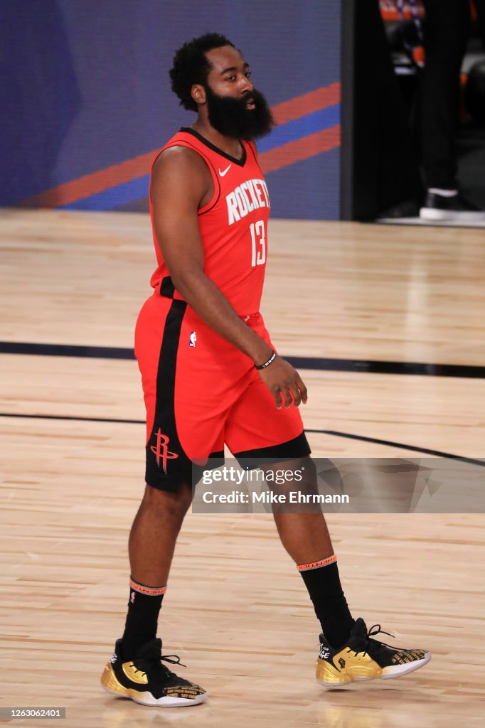 Harden Rockets James Harden of the Houston Rockets walks on the court during the ...
