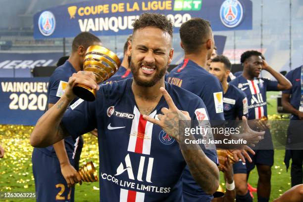 Neymar Jr of PSG celebrates the victory during the trophy ceremony following the French League Cup final between Paris Saint-Germain and Olympique...