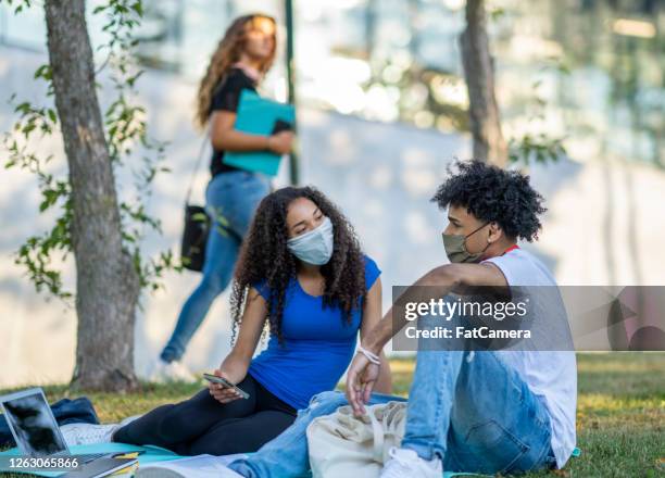 college students wearing masks on campus - canada covid stock pictures, royalty-free photos & images