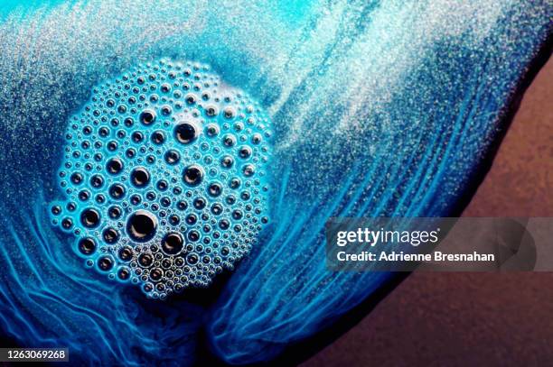 chemical reaction abstract bubbling blue - chemical reaction abstract stock pictures, royalty-free photos & images