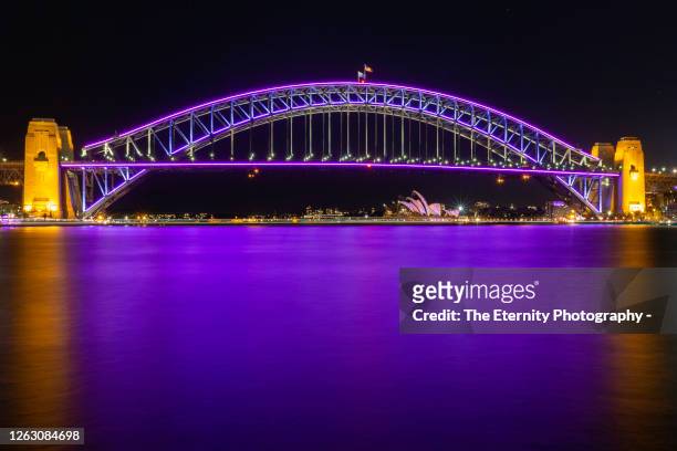 harbour bridge lit with vivid sydney light beams - vivid sydney stock pictures, royalty-free photos & images