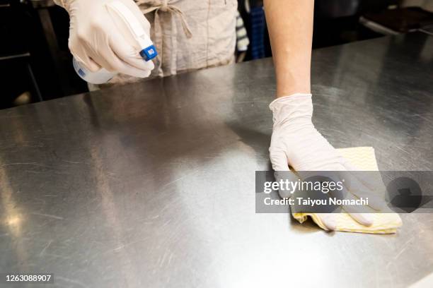 disinfecting the kitchen before opening - restaurant cleaning stock pictures, royalty-free photos & images