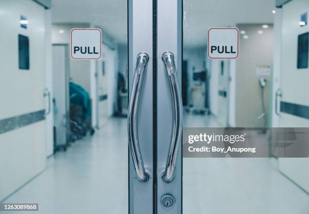 closed-doors before entering to o.r (operating room) area in hospital. - clinical background stock pictures, royalty-free photos & images