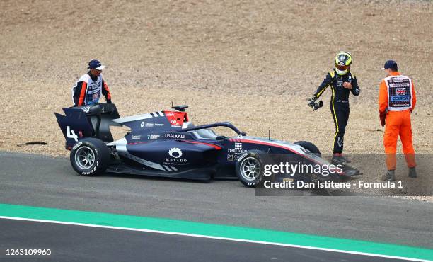 Max Fewtrell of Great Britain and Hitech Grand Prix walks from his car after a crash during race one of the Formula 3 Championship at Silverstone on...