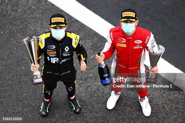 Second placed Oscar Piastri of Australia and Prema Racing and third placed Logan Sargeant of United States and Prema Racing celebrate on the podium...
