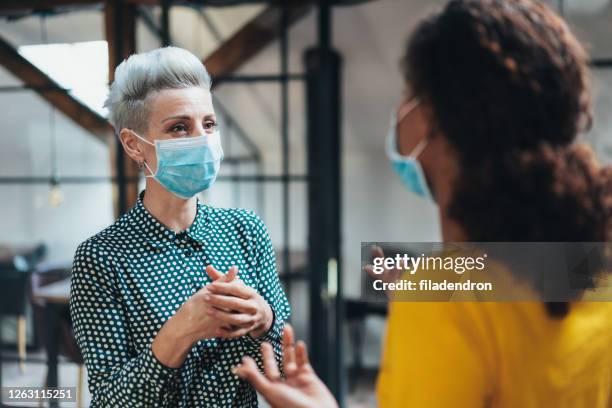 place of work - business meeting with masks stock pictures, royalty-free photos & images