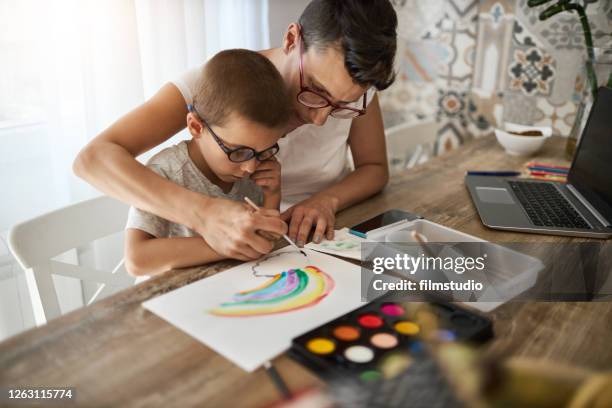 making a rainbow sign during coronavirus quarantine - nhs rainbow stock pictures, royalty-free photos & images