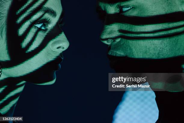 couple close to kiss with shadows on faces - stock photo - the love machine stock pictures, royalty-free photos & images