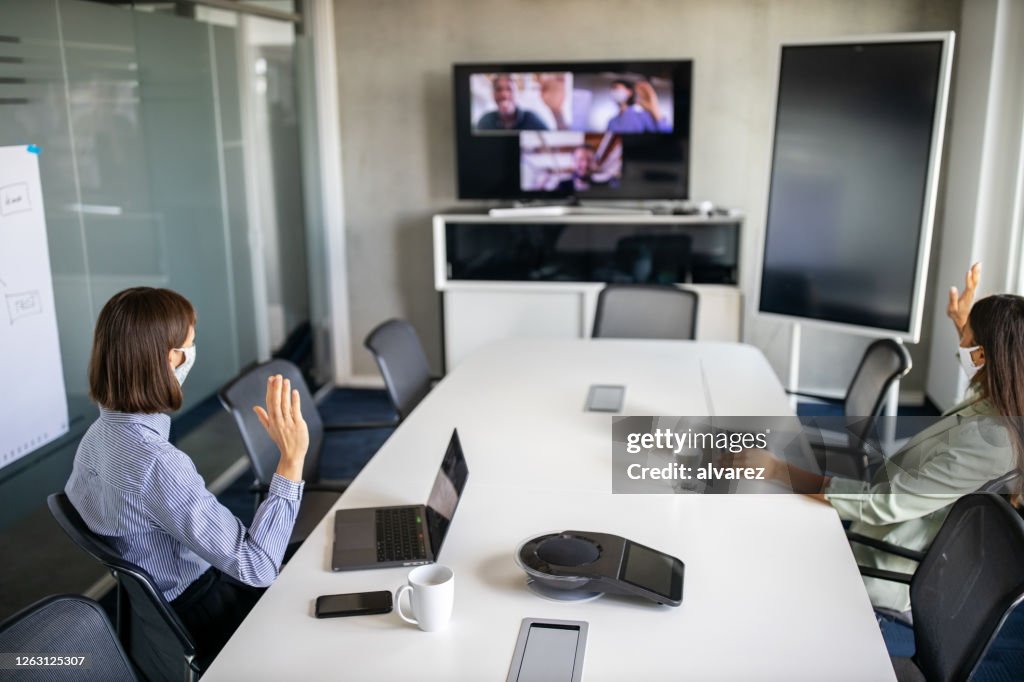 Business team having a meeting over internet during pandemic