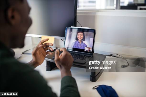 business people video conferencing on laptop - remote meeting stock pictures, royalty-free photos & images