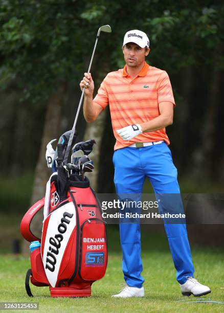 Benjamin Hebert of France picks a club from his golf bag on the ninth hole during Day three of the Hero Open at Marriott Forest of Arden on August...