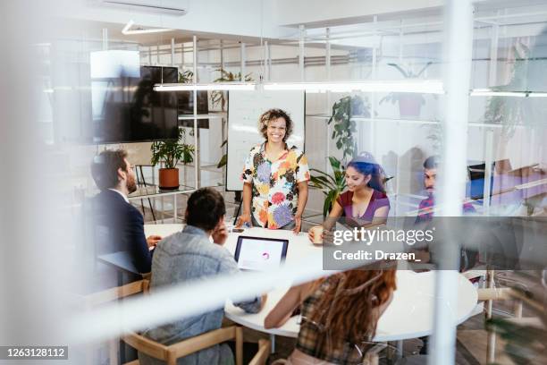 business people sitting in board room and keep social distance - crowdfunding stock pictures, royalty-free photos & images