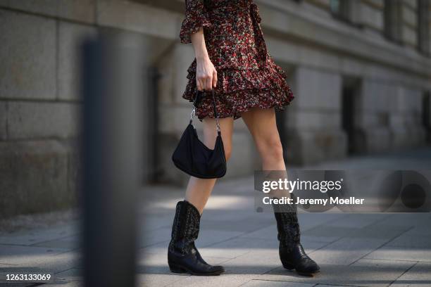 Eva Staudinger wearing SET Fashion dress and vintage cowboy boots on July 31, 2020 in Hamburg, Germany.