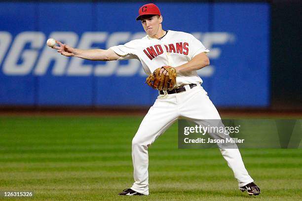 Second baseman Cord Phelps of the Cleveland Indians throws to first after fielding a ground ball during the seventh inning against the Minnesota...