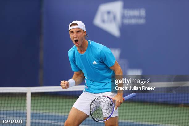 Joe Salisbury of British Bulldogs celebrates winning the first set during his men's doubles match with doubles partner Kyle Edmund against Andy...