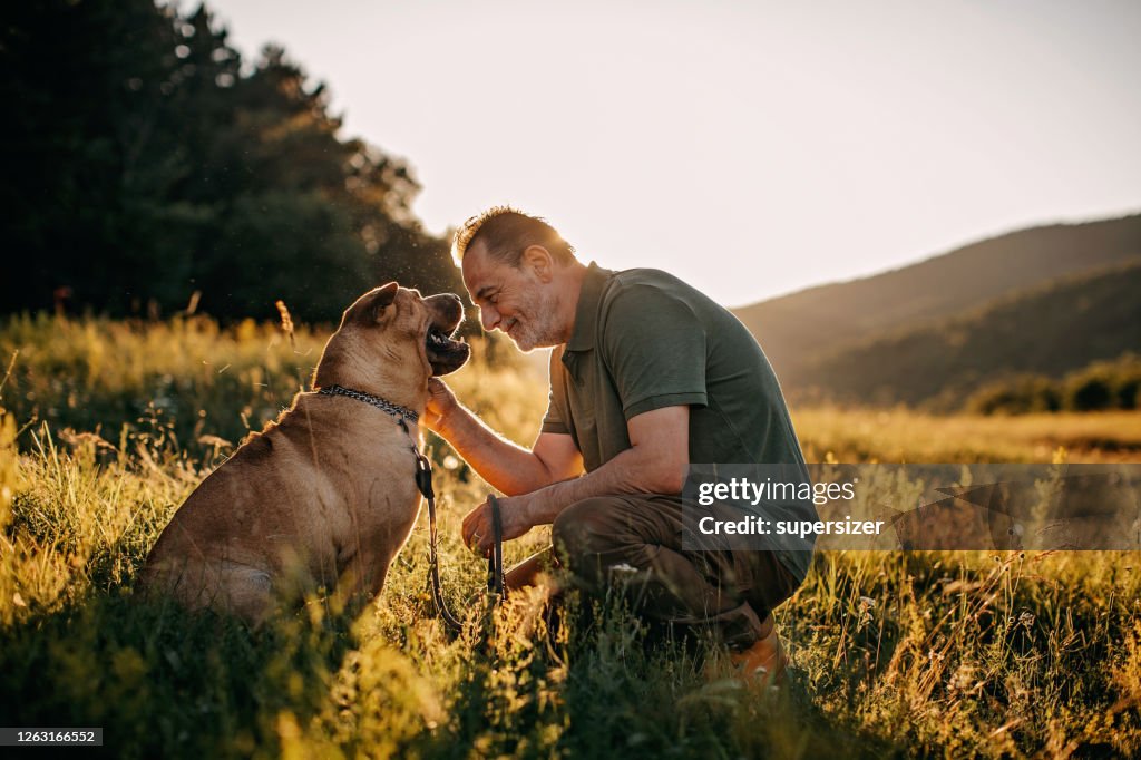 Senior man walking his dog