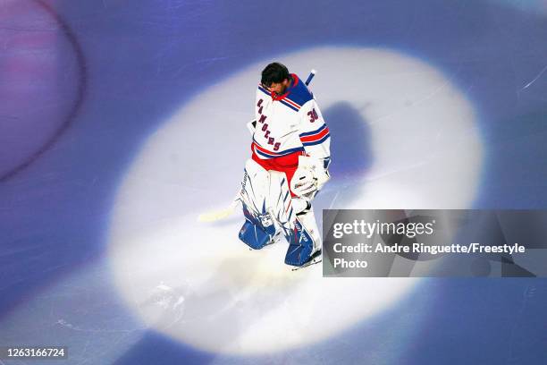 Henrik Lundqvist of the New York Rangers prepares to start in the nets against the Carolina Hurricanes in Game One of the Eastern Conference...