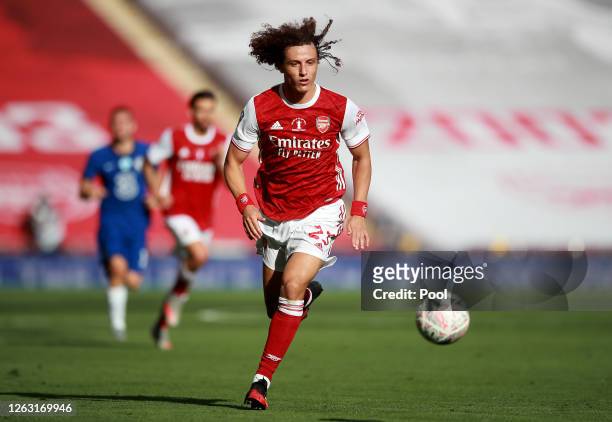 David Luiz of Arsenal runs with the ball during the Heads Up FA Cup Final match between Arsenal and Chelsea at Wembley Stadium on August 01, 2020 in...