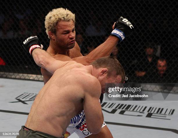 Josh Koscheck punches Matt Hughes during the UFC 135 event at the Pepsi Center on September 24, 2011 in Denver, Colorado.