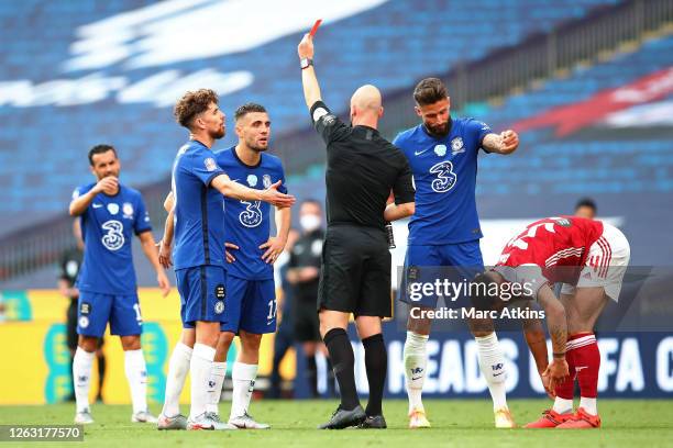 Referee Anthony Taylor awards Mateo Kovacic of Chelsea a red card, after he receives a second yellow card during the FA Cup Final match between...