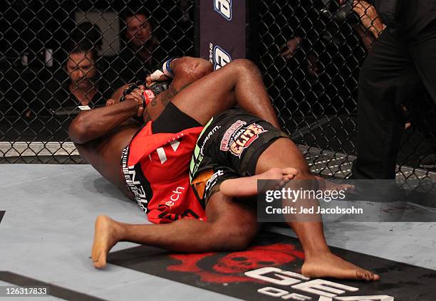 Jon Jones secures a rear choke submission against Quinton "Rampage" Jackson during the UFC 135 event at the Pepsi Center on September 24, 2011 in...