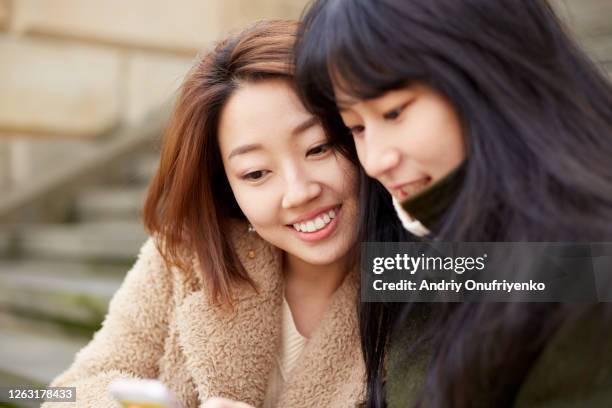 best friends - korean ethnicity stock-fotos und bilder