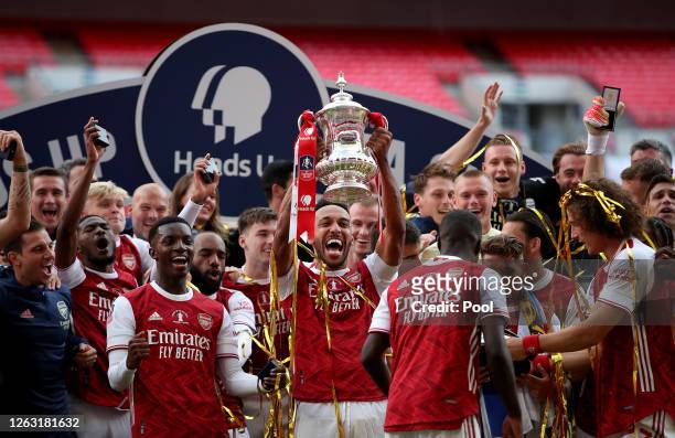 Pierre-Emerick Aubameyang of Arsenal lifts the FA Cup Trophy with his team mates after their victory in the Heads Up FA Cup Final match between...