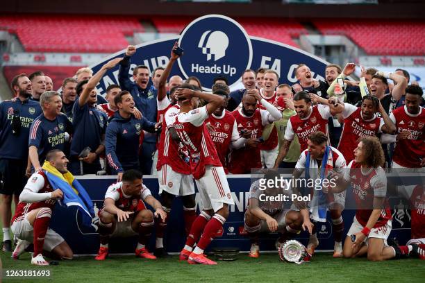 Pierre-Emerick Aubameyang of Arsenal drops the FA Cup Trophy before lifting it with his team mates after their victory in the Heads Up FA Cup Final...