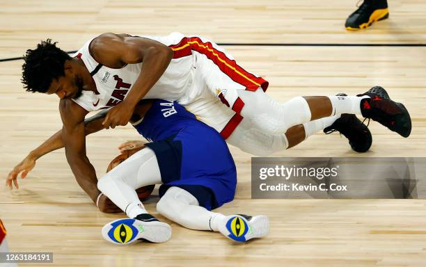 Monte Morris of the Denver Nuggets looses the ball against Jimmy Butler of the Miami Heat at HP Field House at ESPN Wide World Of Sports Complex on...