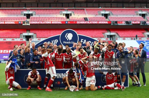 Arsenal captain Pierre-Emerick Aubameyang of Arsenal drops the FA Cup Trophy following the FA Cup Final match between Arsenal and Chelsea at Wembley...