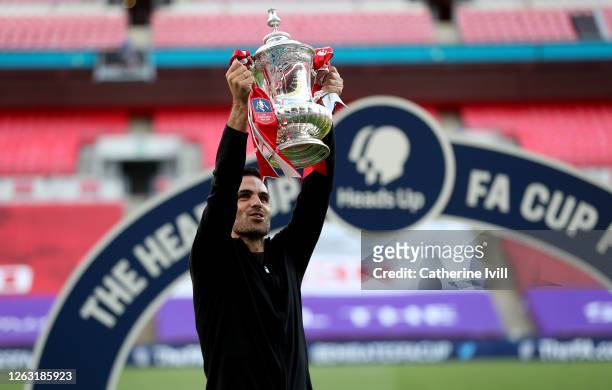 Mikel Arteta, Manager of Arsenal lifts the FA Cup Trophy after his teams victory in the Heads Up FA Cup Final match between Arsenal and Chelsea at...