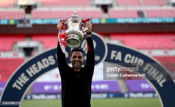 Mikel Arteta, Manager of Arsenal lifts the FA Cup Trophy after his teams victory in the Heads Up FA Cup Final match between Arsenal and Chelsea at...