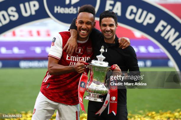 Pierre-Emerick Aubameyang of Arsenal and Mikel Arteta, Manager of Arsenal celebrate with the Heads Up Emirates FA Cup Trophy following their team's...