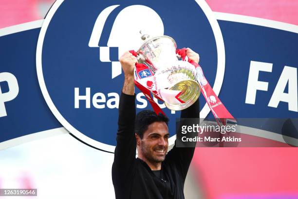 Mikel Arteta, Manager of Arsenal celebrates with the Heads Up Emirates FA Cup Trophy following his team's victory in the FA Cup Final match between...