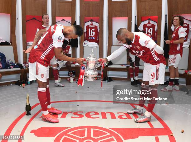 Pierre-Emerick Aubmeyang and Alex Lacazette celebrate after the FA Cup Final match between Arsenal and Chelsea at Wembley Stadium on August 01, 2020...