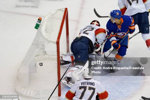 Jean-Gabriel Pageau of the New York Islanders scores a goal on Sergei Bobrovsky of the Florida Panthers during the first period in Game One of the...