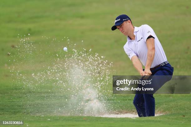 Justin Thomas of the United States plays a shot from a bunker on the 16th hole during the third round of the World Golf Championship-FedEx St Jude...