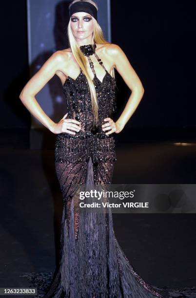 Model walks the runway during the Versace Haute Couture Spring/Summer 2003 fashion show as part of the Paris Haute Couture Fashion Week on January...