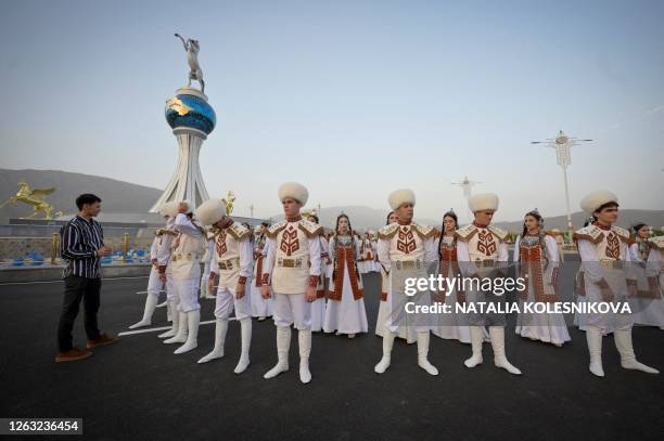 Performers wait prior to the ceremony inaugurating the new city of Arkadag - named in honour of Turkmenistan's former leader Gurbanguly...