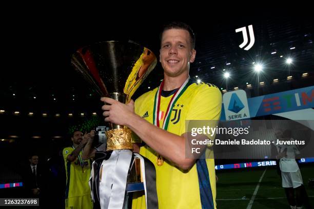 Wojciech Szczesny of Juventus celebrates winning the Italian championship "scudetto" 2019-2020 with the trophy after the Serie A match between...