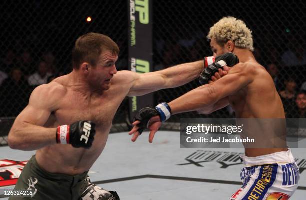 Matt Hughes punches Josh Koscheck during the UFC 135 event at the Pepsi Center on September 24, 2011 in Denver, Colorado.