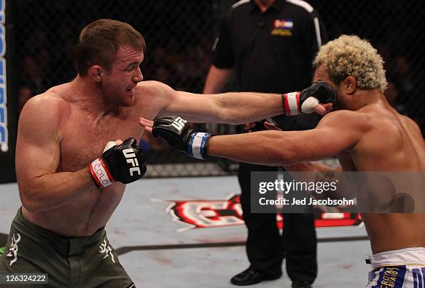 Matt Hughes punches Josh Koscheck during the UFC 135 event at the Pepsi Center on September 24, 2011 in Denver, Colorado.