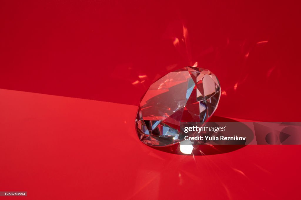 Shiny diamond on the red background