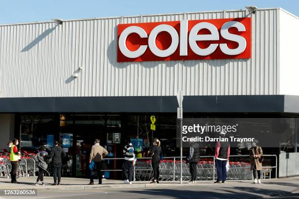 People line up outside a Coles supermarket in Malvern on August 02, 2020 in Melbourne, Australia. Public concern has increased as speculation grows...