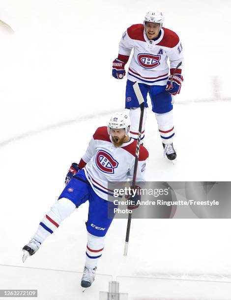 Jeff Petry of the Montreal Canadiens celebrates his game winning goal with teammate Brendan Gallagher in the overtime period against the Pittsburgh...