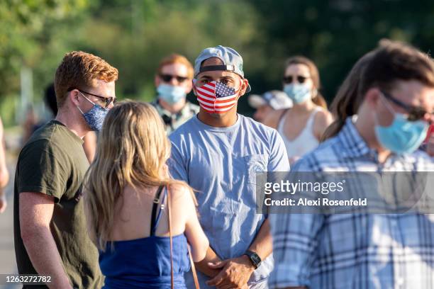 Man wearing an American flag mask is seen near Chelsea Piers as the city continues Phase 4 of re-opening following restrictions imposed to slow the...